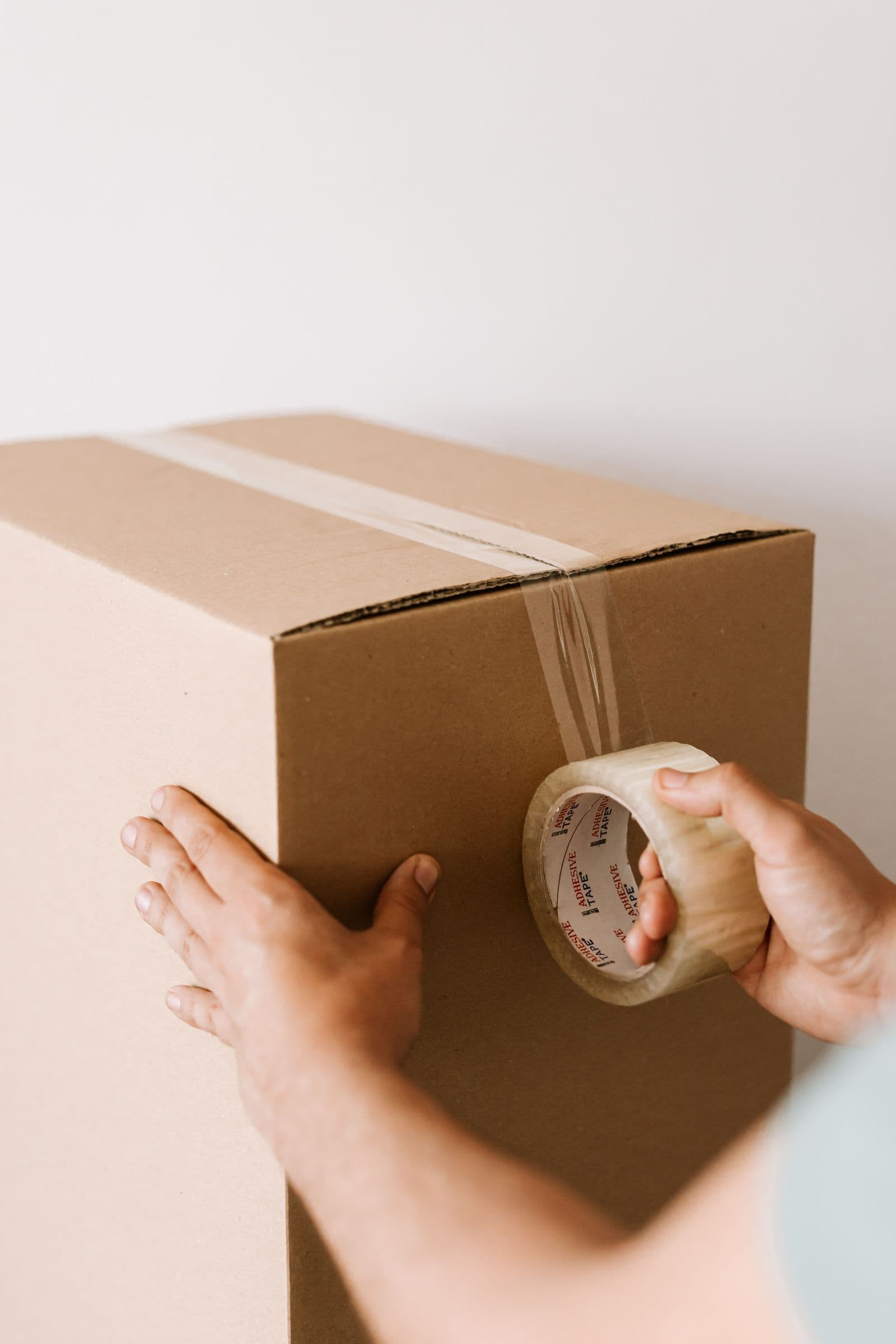A package being carefully sealed for delivery